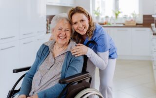 A senior woman in a wheelchair and her caregiver at the best skilled nursing in San Diego